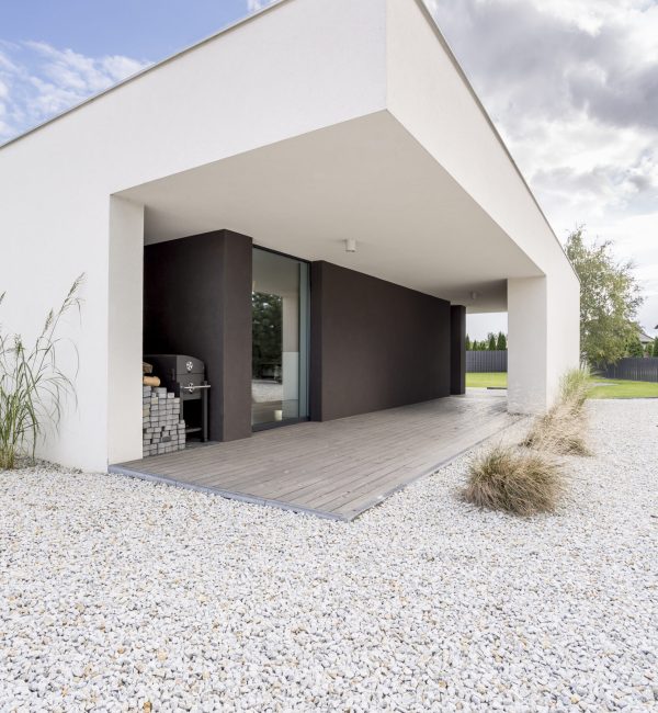 Backyard of modern, minimalistic house in daylight